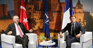 President Recep Tayyip Erdoğan (L) and French President Emmanuel Macron pose for a photo during their bilateral meeting as part of the NATO summit at the Ifema congress center in Madrid, Spain, June 29, 2022. (AFP Photo)
