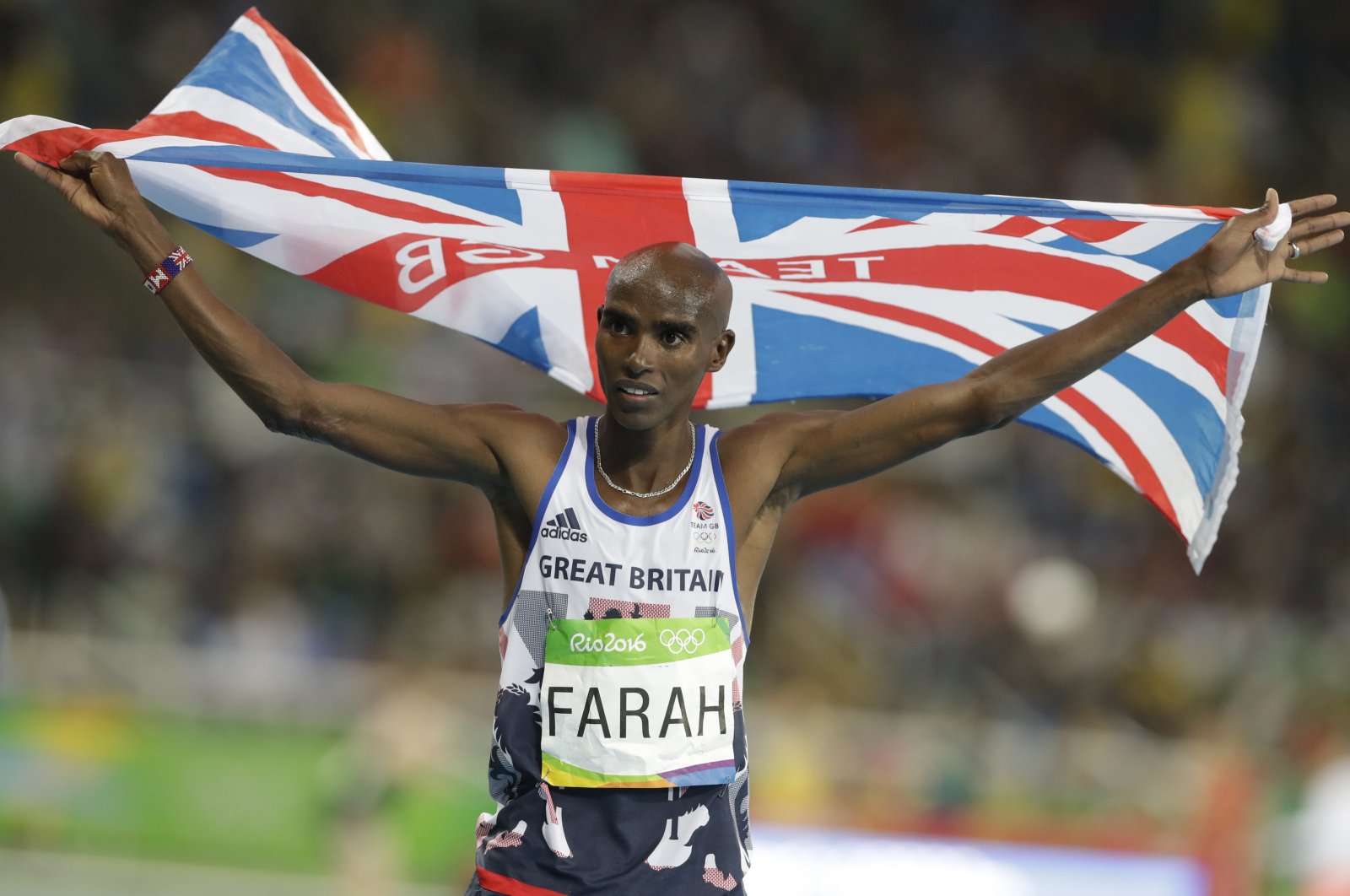 Britain&#039;s Mo Farah celebrates winning the gold medal in the men&#039;s 10,000-meter final during the athletics competitions of the 2016 Summer Olympics at the Olympic stadium in Rio de Janeiro, Brazil, Aug. 13, 2016. Four-time Olympic champion Mo Farah has disclosed he was brought into Britain illegally from Djibouti under the name of another child. The British athlete made the revelation in a BBC documentary. (AP File Photo)