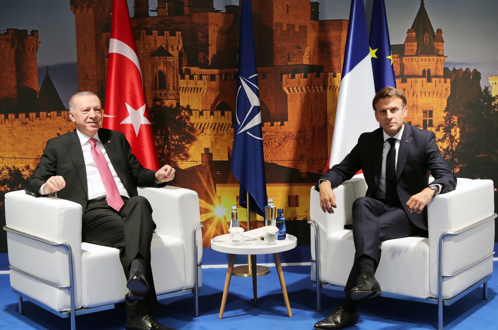 President Recep Tayyip Erdoğan (L) and French President Emmanuel Macron pose for a photo during their bilateral meeting as part of the NATO summit at the Ifema congress center in Madrid, Spain, June 29, 2022. (AFP Photo)