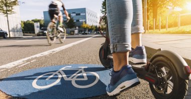 Before bicycles became popular among children, steel scooters with two small bicycle wheels were more common. (Shutterstock Photo)