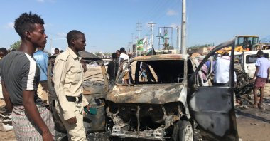 Somali security forces assess the scene of a car bomb explosion at a checkpoint in Mogadishu, Somalia  Dec. 28, 2019. (Reuters File Photo)