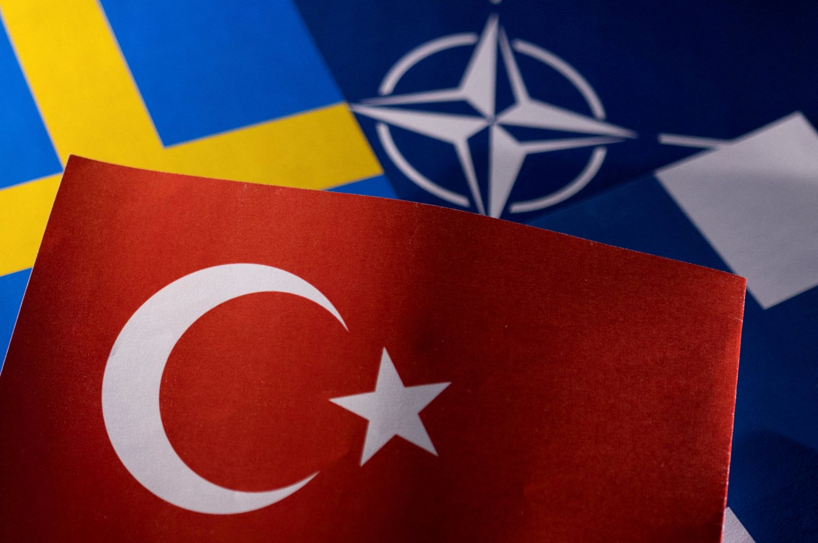 FILE PHOTO: NATO, Turkish, Swedish and Finnish flags are seen in this illustration taken May 18, 2022. REUTERS/Dado Ruvic/Illustration/File Photo