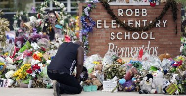 Reggie Daniels pays his respects at a memorial at Robb Elementary School, Uvalde, Texas, U.S., June 9, 2022. (AP Photo)