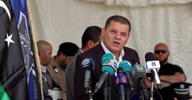 Libya&#039;s interim Prime Minister Abdul Hamid Dbeibah speaks during a military graduation ceremony in the capital Tripoli, Libya, July 3, 2022. (Photo by Mahmud Turkia / AFP)