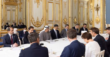 This handout image provided by the UAE Ministry of Presidential Affairs shows (L to R) UAE's President Sheikh Mohamed bin Zayed Al Nahyan meeting with France's President Emmanuel Macron at the Elysee Palace in Paris on July 18, 2022, as part of Sheikh Mohammed's first overseas state visit with energy and transport deals on the agenda. (AFP Photo)