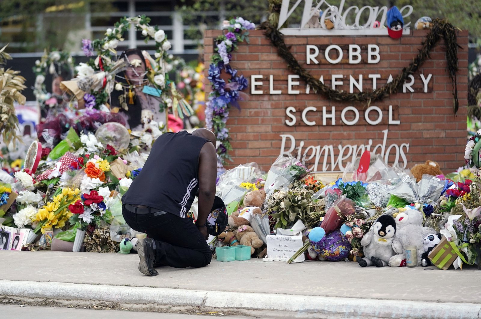 Reggie Daniels pays his respects at a memorial at Robb Elementary School, Uvalde, Texas, U.S., June 9, 2022. (AP Photo)