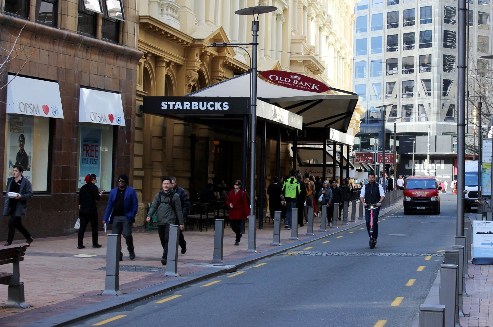 People walk outside a Starbucks cafe on Lambton Quay street in Wellington, New Zealand, July 23, 2020. (Reuters Photo)