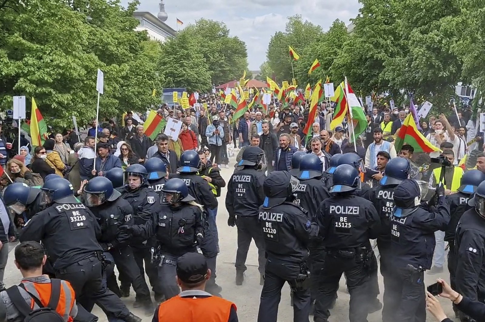 PKK supporters demonstrate against Turkish policy and briefly clash with police in Berlin, Germany, Saturday, May 14, 2022. (AP)
