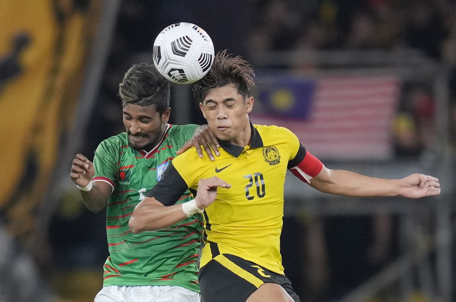 Malaysia&#039;s Muhammad Syafiq Ahmad (R) vies with Bangladesh&#039;s Tutul Badsha during a AFC Asian Cup 2023 qualifier, Kuala Lumpur, Malaysia, Tuesday, June 14, 2022. (AP Photo)
