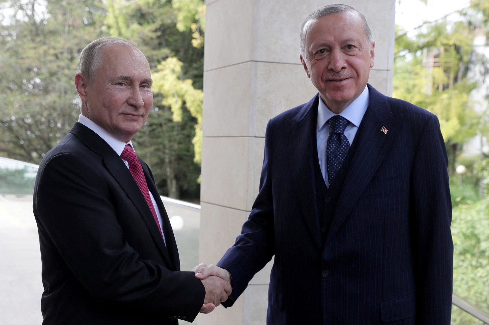 President Recep Tayyip Erdoğan (R) shakes hands with Russian President Vladimir Putin during a meeting in Sochi, Russia, Sept. 29, 2021. (Reuters Photo)
