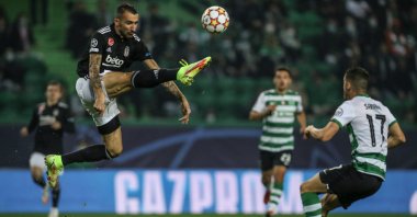 Beşiktaş player Mehmet Topal (L) in action during a UEFA Champions League match against Sporting, Lisbon, Portugal, Nov. 3, 2021. (EPA Photo)