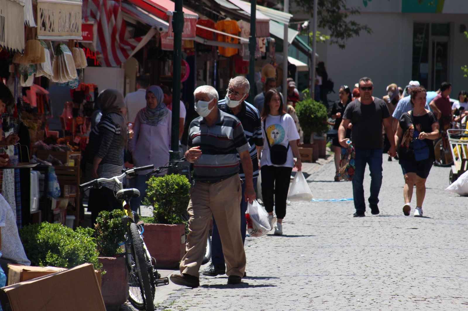 People walk on a street in Eskişehir, central Turkey, July 18, 2022. (İHA PHOTO)