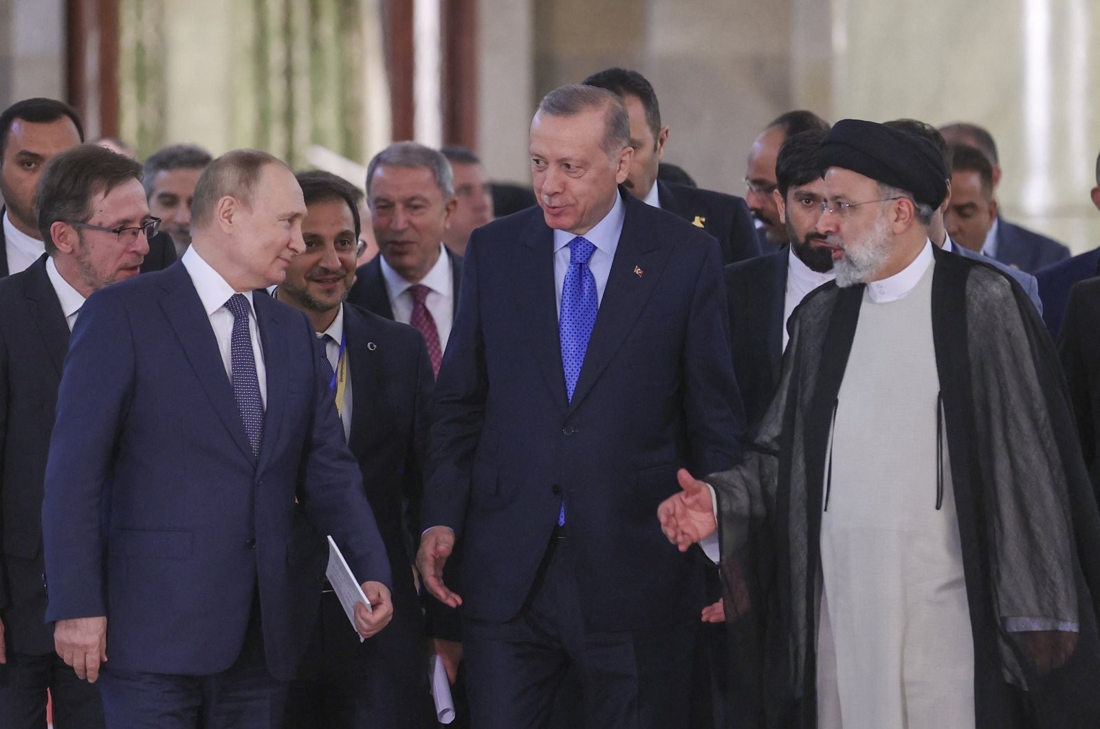 President Recep Tayyip Erdoğan (C), Iranian President Ebrahim Raisi (R) and Russian President Vladimir Putin (L) arrive for a joint news conference after the Astana Trilateral Summit, Tehran, Iran, July 19, 2022. (AFP Photo)