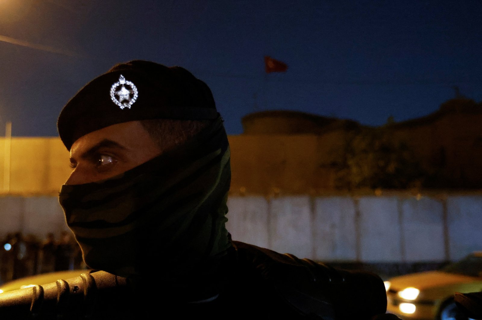 A riot police officer stands in front of a building belonging to the Turkish Embassy during a demonstration against the attack in Iraq&#039;s northern province of Dohuk, in Baghdad, Iraq, July 20, 2022. (Reuters Photo)