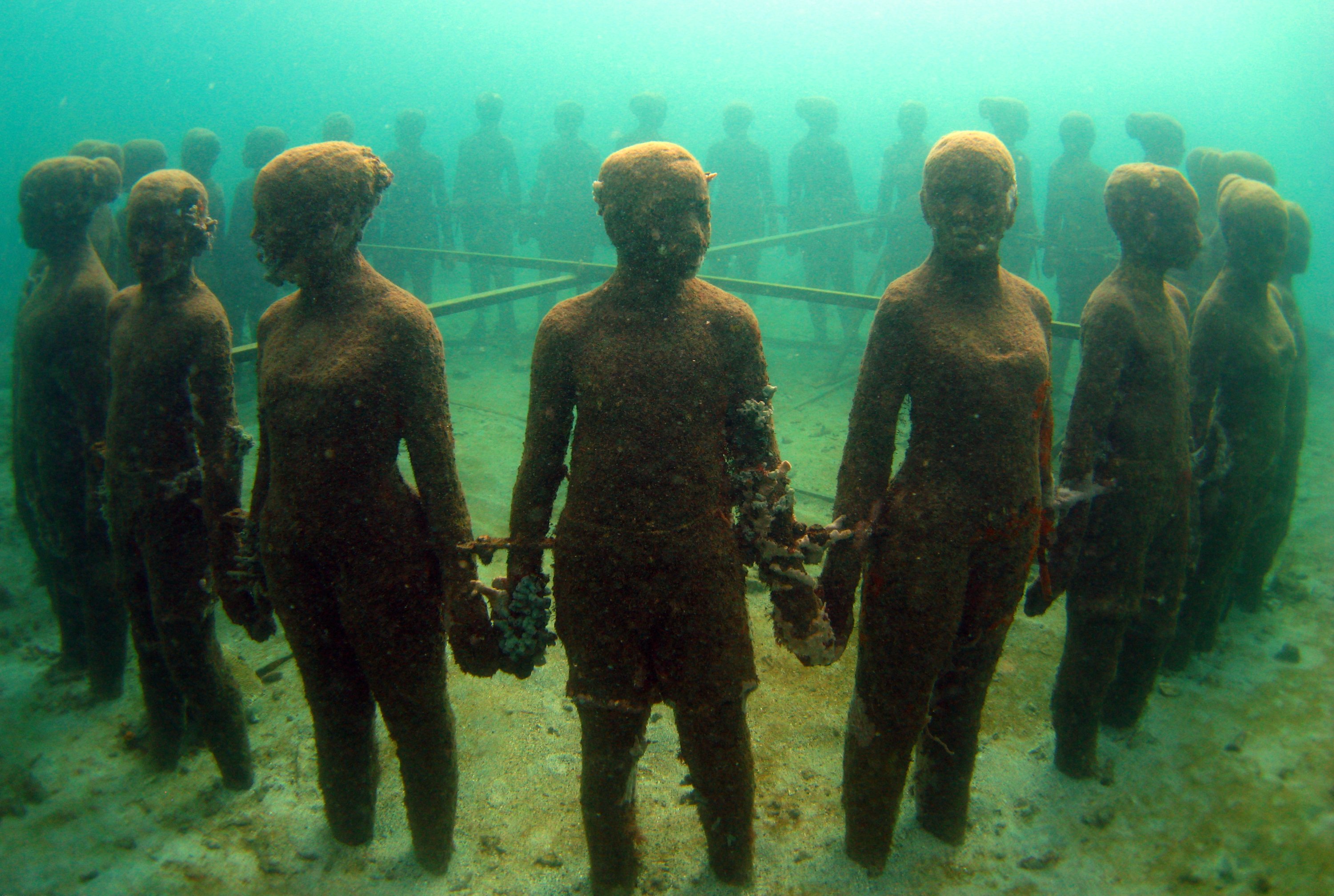 An installation of a ring of children holding hands, Molinere Underwater Sculpture Park, Grenada. (Shutterstock Photo)