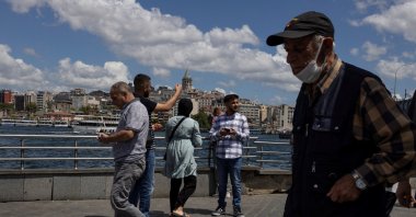 People walk near Eminönü pier in Istanbul, Turkey, July 20, 2022. (Reuters Photo) 