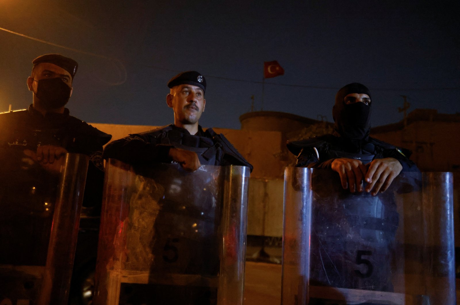 Riot police officers stand in front of a building belonging to the Turkish Embassy during a demonstration against an attack on a mountain resort in Iraq&#039;s northern province of Dohuk, in Baghdad, Iraq, July 20, 2022. (REUTERS Photo)