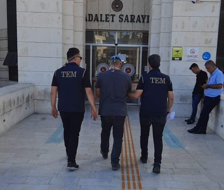 Police escort a detained FETÖ suspect in Balıkesir, western Turkey, July 20, 2022. (İHA PHOTO)
