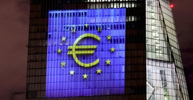 A symphony of light consisting of bars, lines and circles in blue and yellow, the colors of the European Union, illuminates the south facade of the ECB headquarters in Frankfurt, Germany, Dec. 30, 2021. (Reuters Photo)