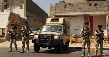 Libyan army forces and vehicles are stationed in a street in the country’s capital of Tripoli, Libya, Friday, July 22, 2022. (AP Photo)