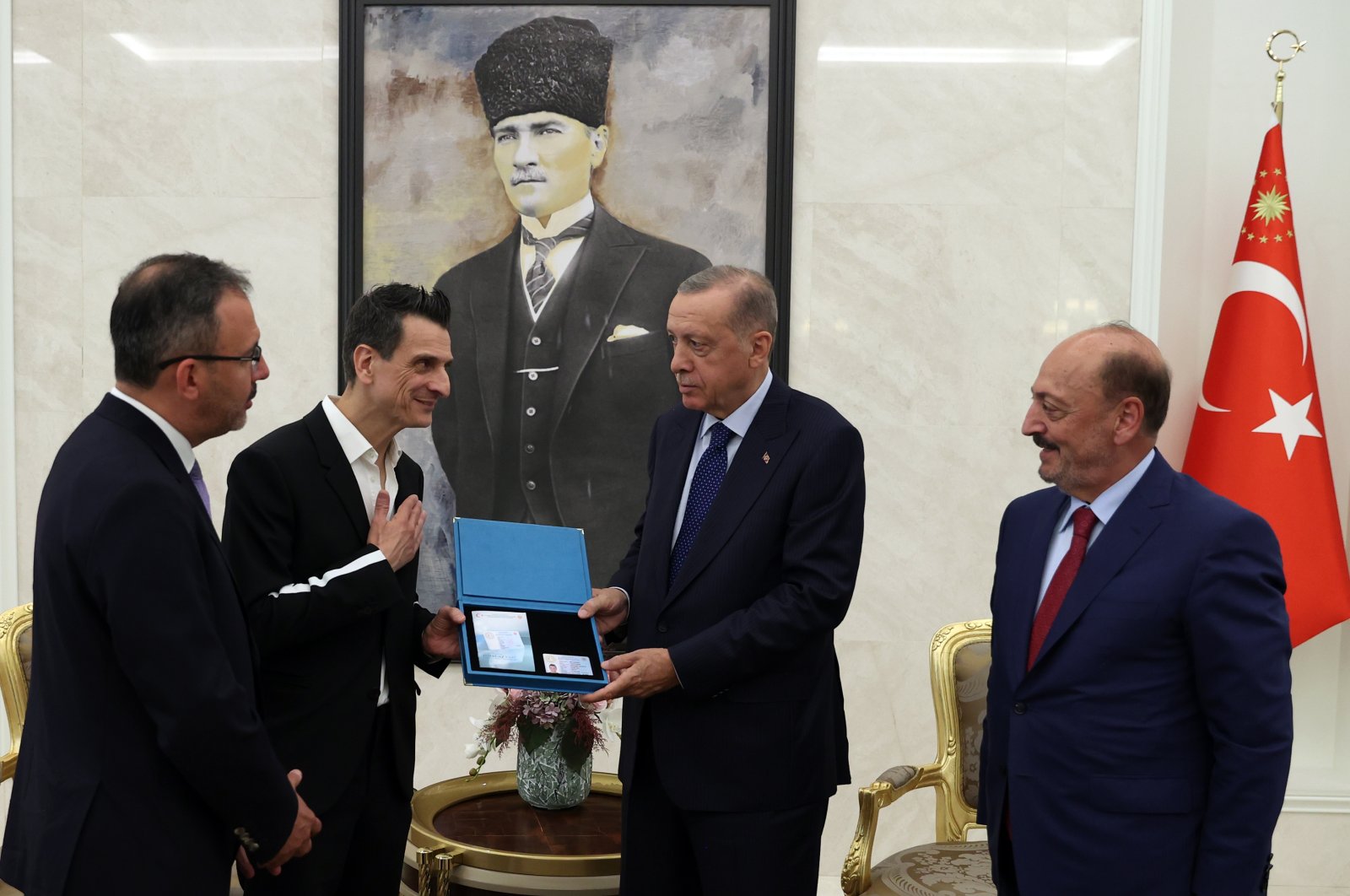 President Recep Tayyip Erdoğan hands the card to Giovanni Guidetti, in the capital Ankara, Turkey, July 21, 2022. (AA PHOTO)