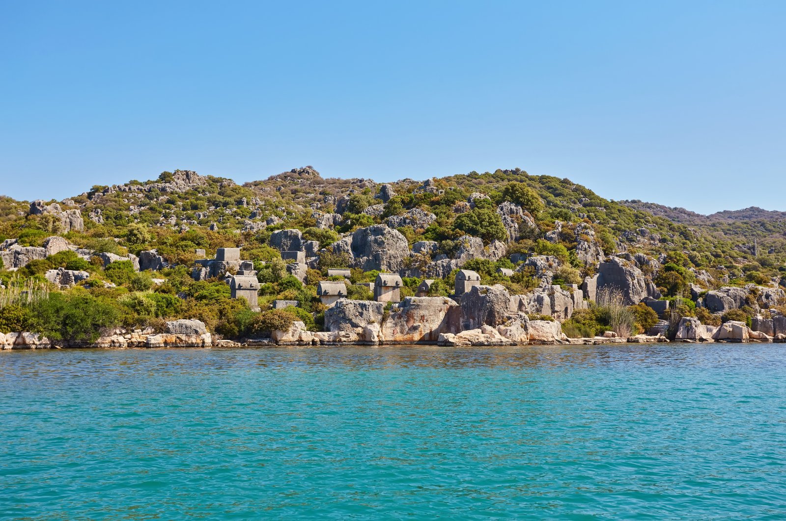 A view of the coast of Kekova island in the Mediterranean sea, which is picturesque with the ruins of the ancient Lycian town of Aperlai. (Shutterstock Photo)