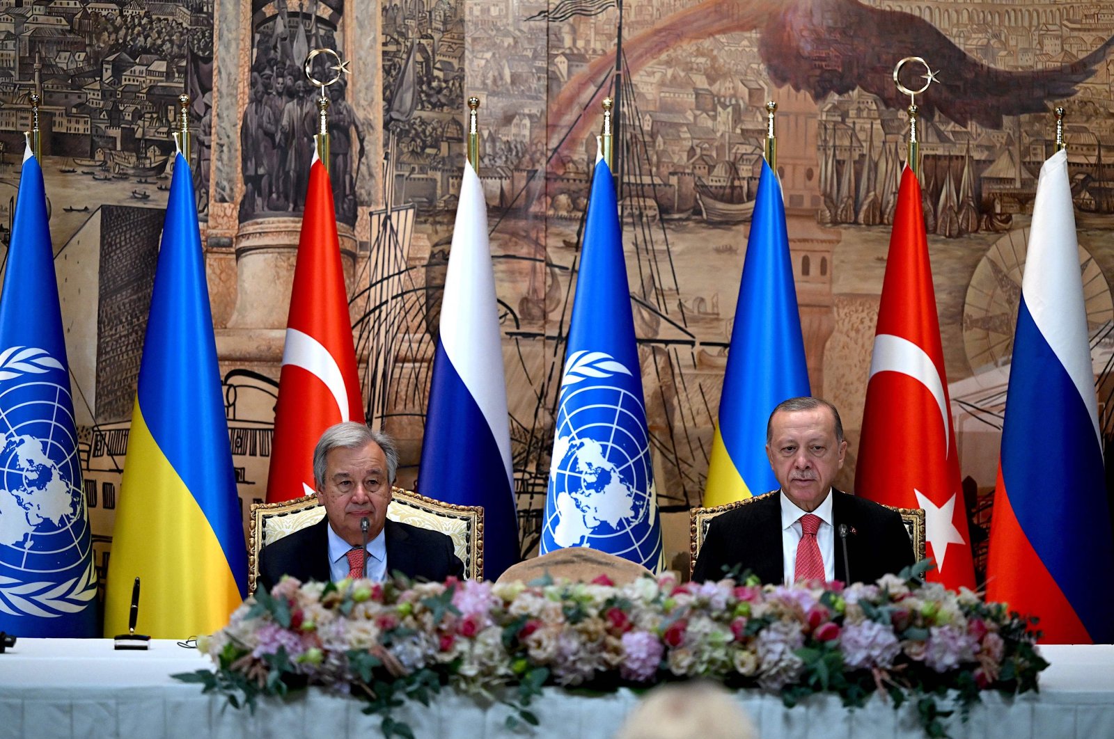 United Nations Secretary-General Antonio Guterres (L) and President Recep Tayyip Erdoğan sit at the start of the signature ceremony of an initiative on the safe transportation of grain and foodstuffs from Ukrainian ports, in Istanbul, Turkey, July 22, 2022. (AFP Photo)