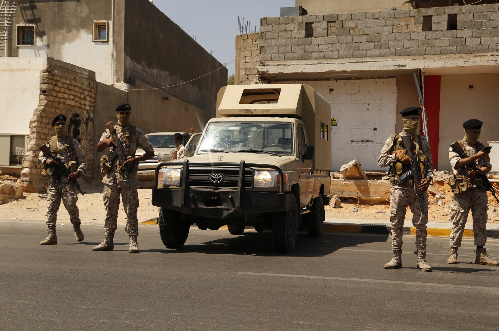 Libyan army forces and vehicles are stationed in a street in the country’s capital of Tripoli, Libya, Friday, July 22, 2022. (AP Photo)