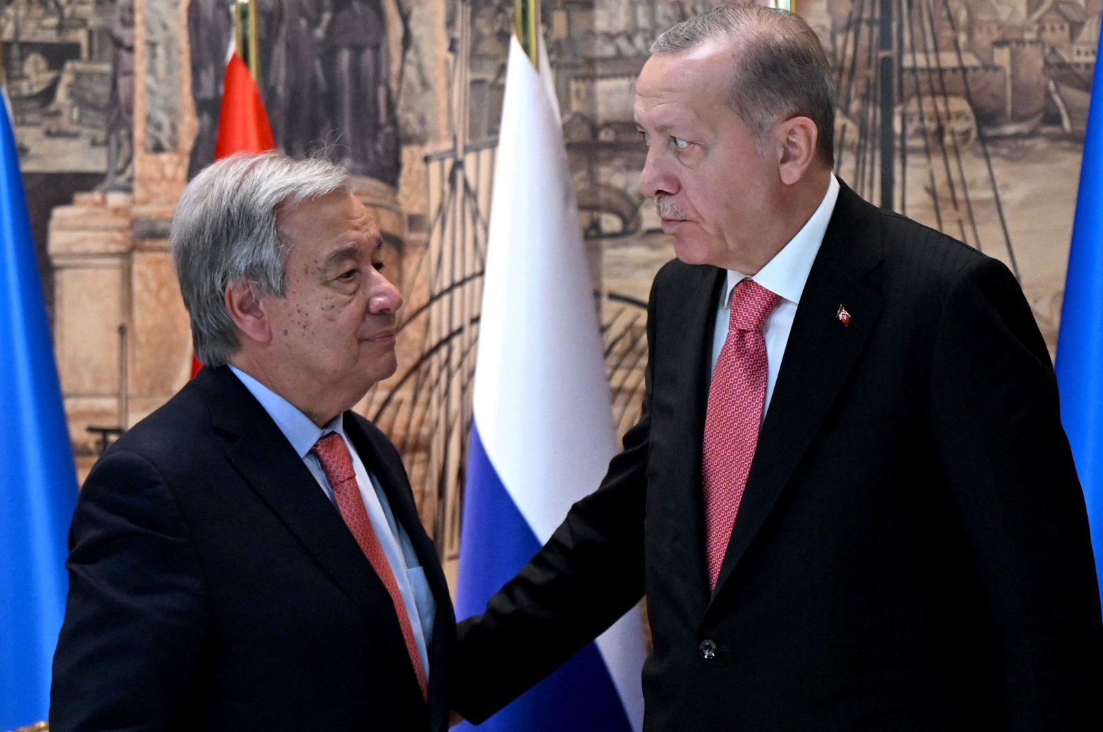 President Recep Tayyip Erdoğan (R) and U.N. Secretary-General Antonio Guterres speak after the signature ceremony of the initiative on the safe transportation of grain and foodstuffs from Ukrainian ports, in Istanbul, Turkey, July 22, 2022. (AFP Photo)