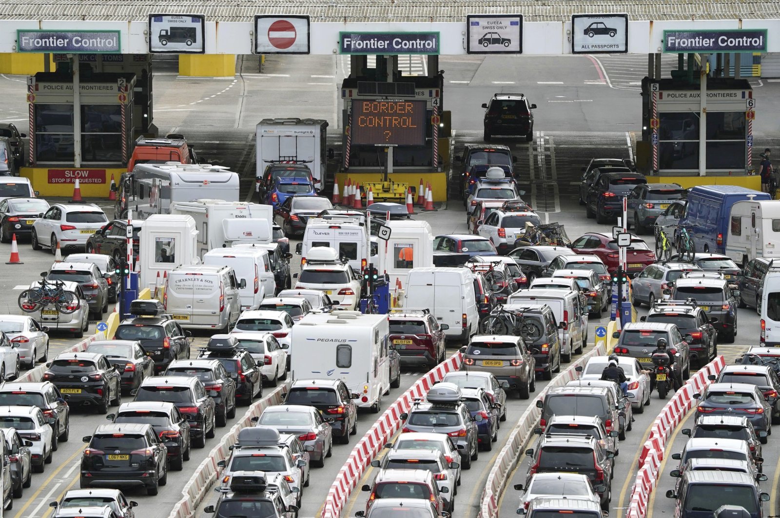 Car queue at the check-in at Dover Port as many families embarks on getaways at the start of summer holidays for many schools in England and Wales, in Kent, the U.K., July 22, 2022. (AP Photo)