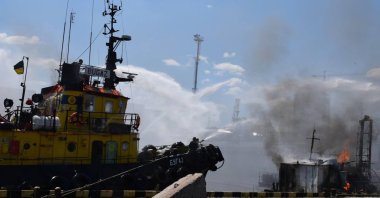 Firefighters working to put out a fire in a sea port of Odessa, southern Ukraine, July 23, 2022. (Odesa City Hall Press Office via EPA)