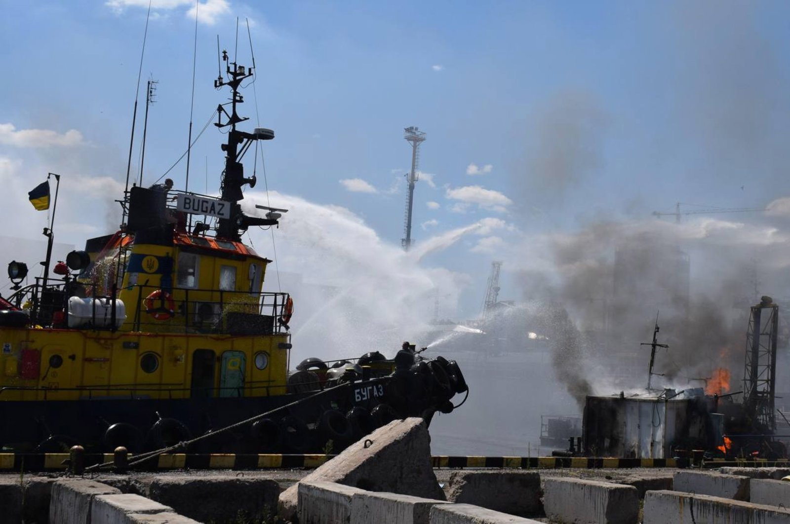 Firefighters working to put out a fire in a sea port of Odessa, southern Ukraine, July 23, 2022. (Odesa City Hall Press Office via EPA)