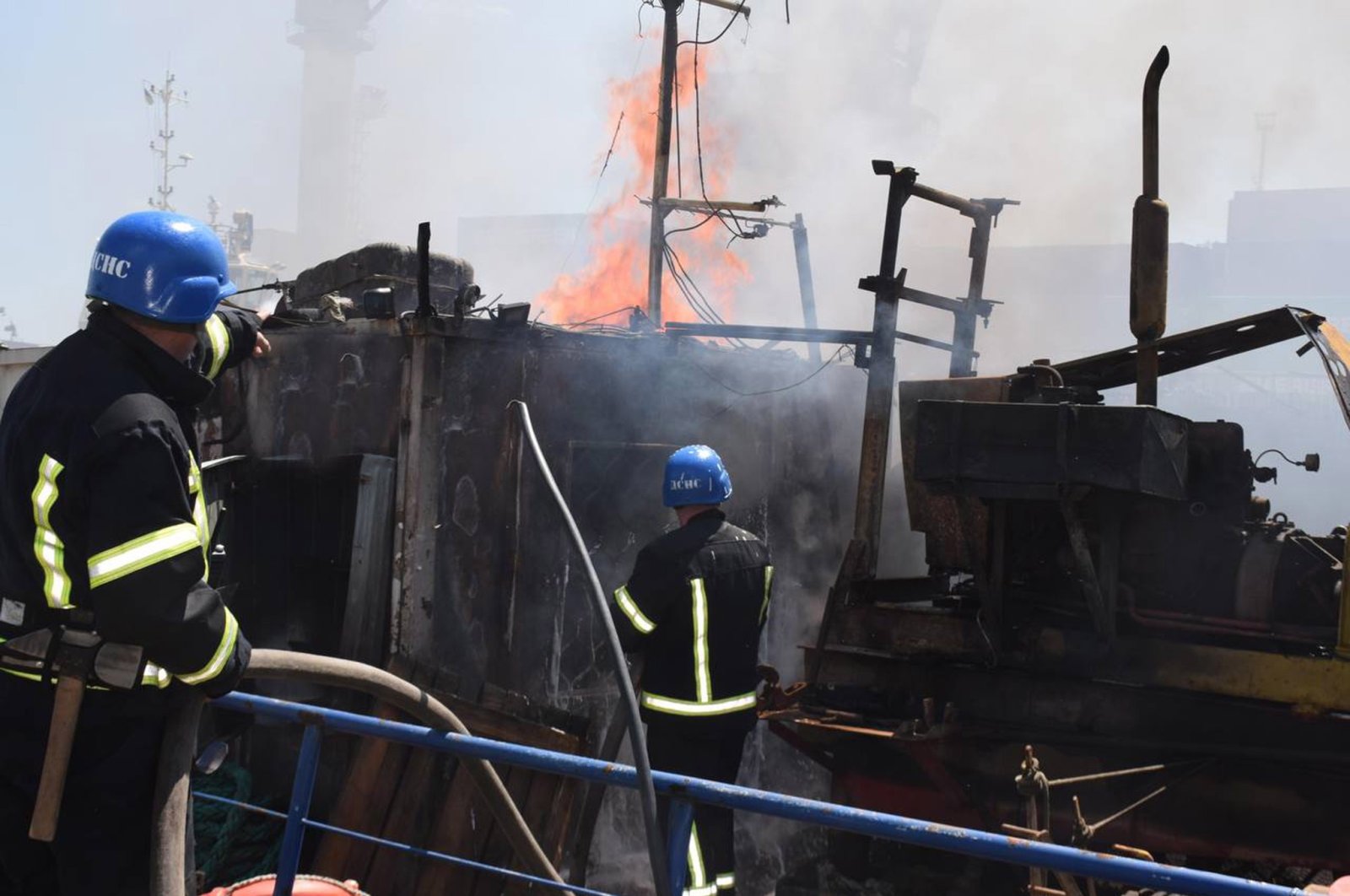 Firefighters work to put out a fire in a sea port in Odessa, southern Ukraine in this handout photo released by Odessa City Hall Press Office on July 23, 2022. (EPA Photo)