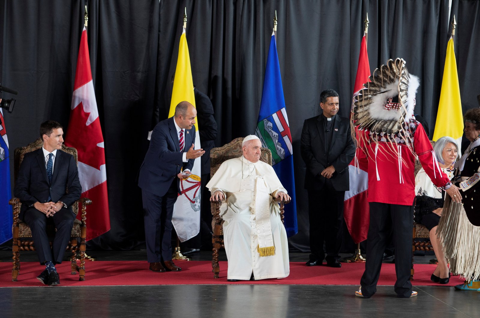 Pope Francis along with Canada&#039;s Prime Minister Justin Trudeau and Governor General of Canada Mary Simon, waits to greet Indigenous dignitaries after he arrives at the Edmonton International Airport near Edmonton, Alberta, Canada July 24, 2022. (Reuters Photo)