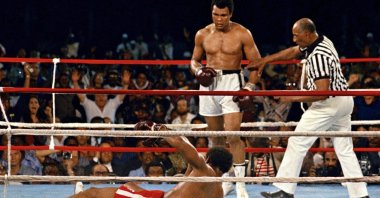 Muhammad Ali (C) in action against defending heavyweight champion George Foreman in the eighth round of their championship bout, Kinshasa, Zaire, Oct. 30, 1974. (AP Photo)
