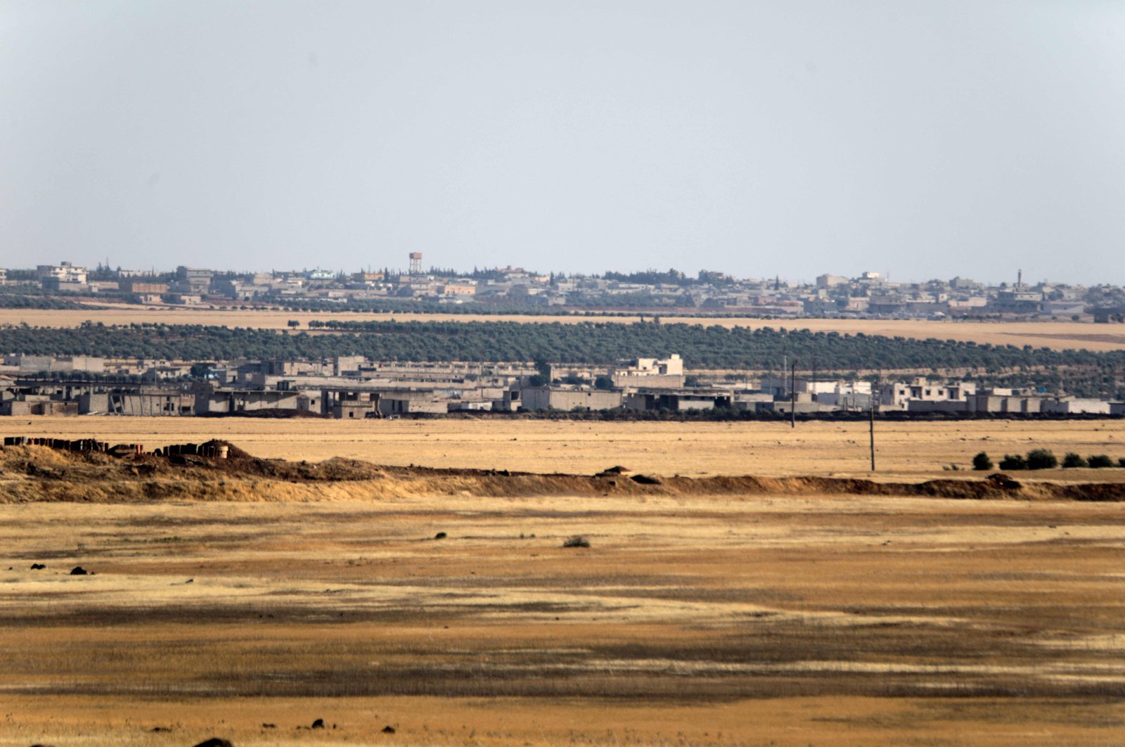 A picture taken on July 19, 2022, from a military position of Turkey-backed forces in the area of Jibrin, in Aleppo&#039;s eastern countryside, shows the YPG-controlled area of Tal Rifaat. (AFP)