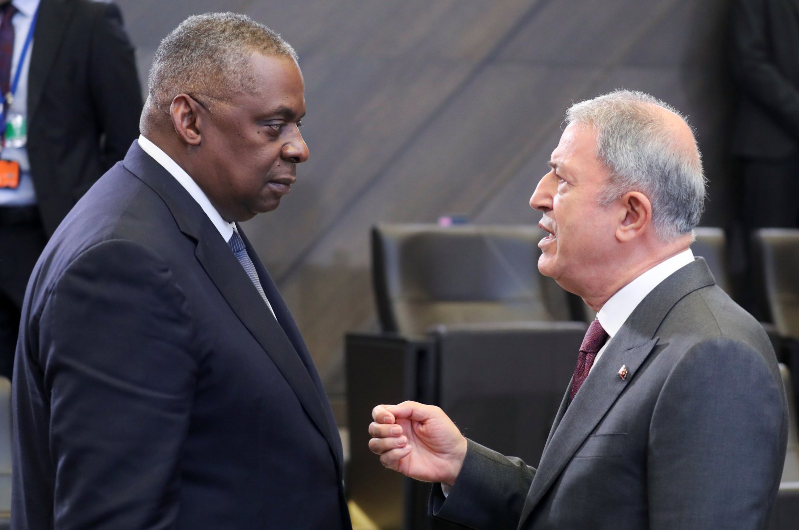 Defense Minister Hulusi Akar speaks with U.S. Defense Secretary Lloyd Austin as they attend a NATO defense ministers meeting in Brussels, Belgium, Oct. 22, 2021. (Reuters Photo)