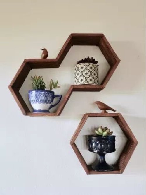 The look of finished hexagon shelves made from wooden popsicle sticks. (Pinterest / via eHow)