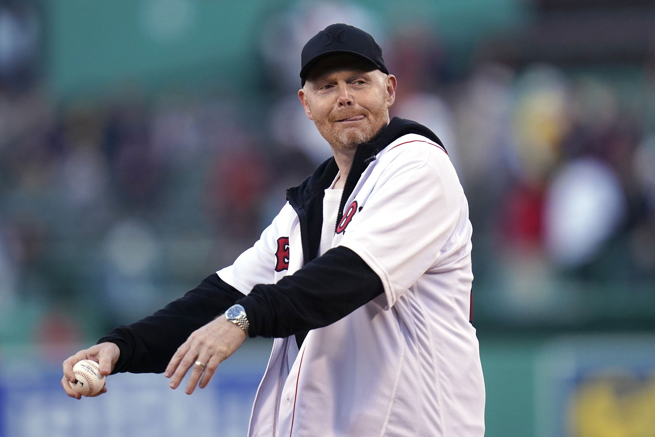 Bill Burr throws out the ceremonial first pitch prior to a baseball game between the Boston Red Sox and Toronto Blue Jays, at Fenway Park in Boston, U.S., April 19, 2022. (AP Photo)