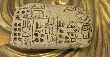 One of the scent formulas by the world&#039;s first female perfumer Tapputi engraved in Akkadian on a clay tablet, Istanbul, Turkey, July 24, 2022. (DHA Photo)