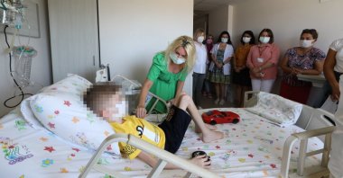 Doctors and nurses visit the boy in his hospital room, in Antalya, Turkey, July 25, 2022. (İHA Photo)