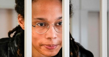 U.S. WNBA basketball superstar Brittney Griner looks from inside a defendants' cage before a hearing at the Khimki Court, Moscow, Russia, July 26, 2022. (AFP Photo)