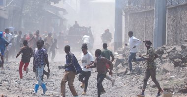 Congolese protesters run after they were dispersed by riot police officers outside the compound of a United Nations peacekeeping force&#039;s warehouse in Goma in the North Kivu province of the Democratic Republic of Congo, July 26, 2022. (REUTERS Photo)