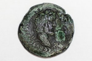 A rare, nearly 1,850-year-old bronze coin discovered off the Israeli coastal city of Haifa is on display at Israel's Antiquities Authority office in Jerusalem, July 26, 2022. (AP Photo/Tsafrir Abayov)