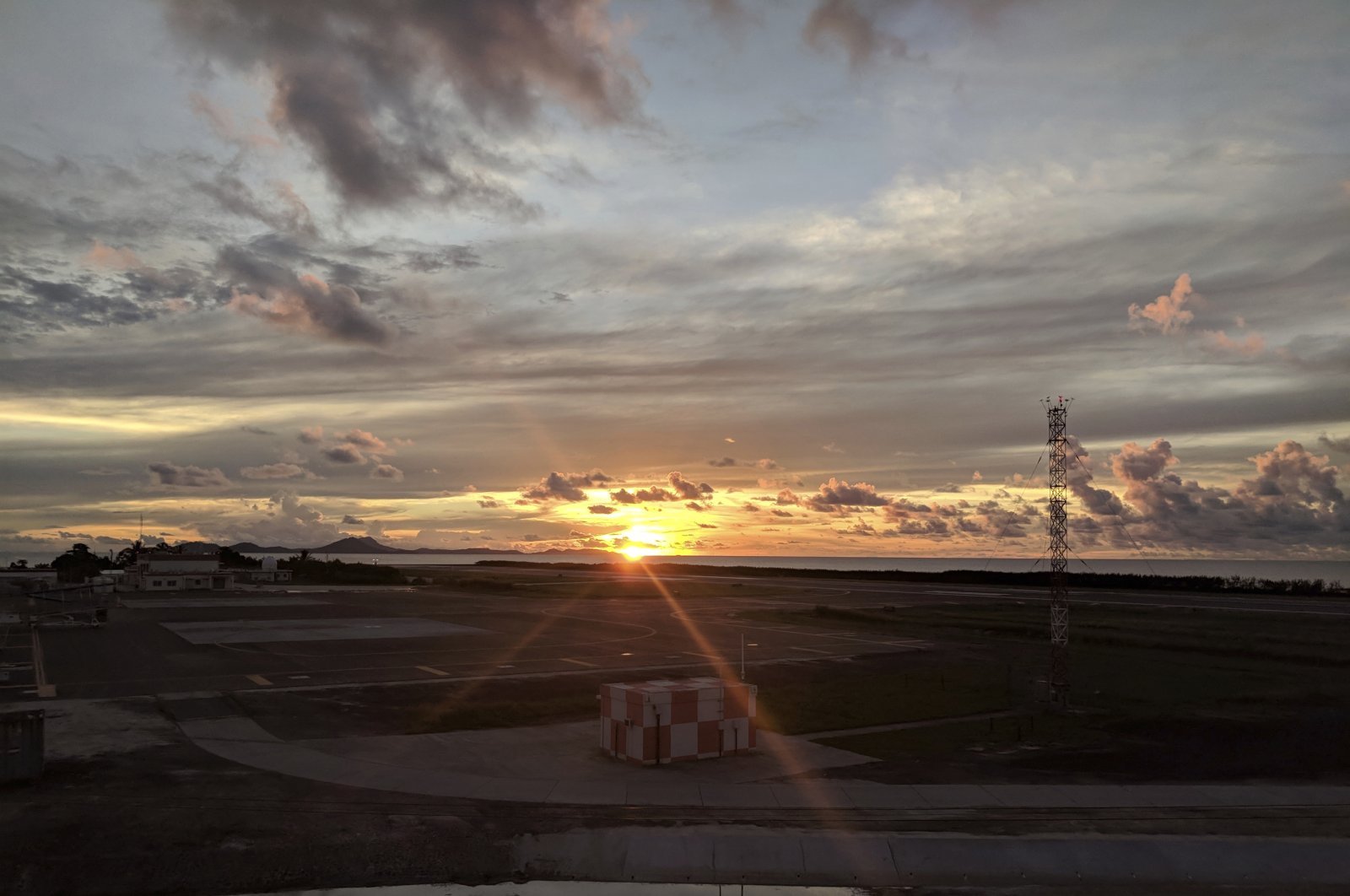 The sun sets over the runway at the Chuuk Airport in Weno, Federated States of Micronesia, Oct. 28, 2017. (AP Photo)