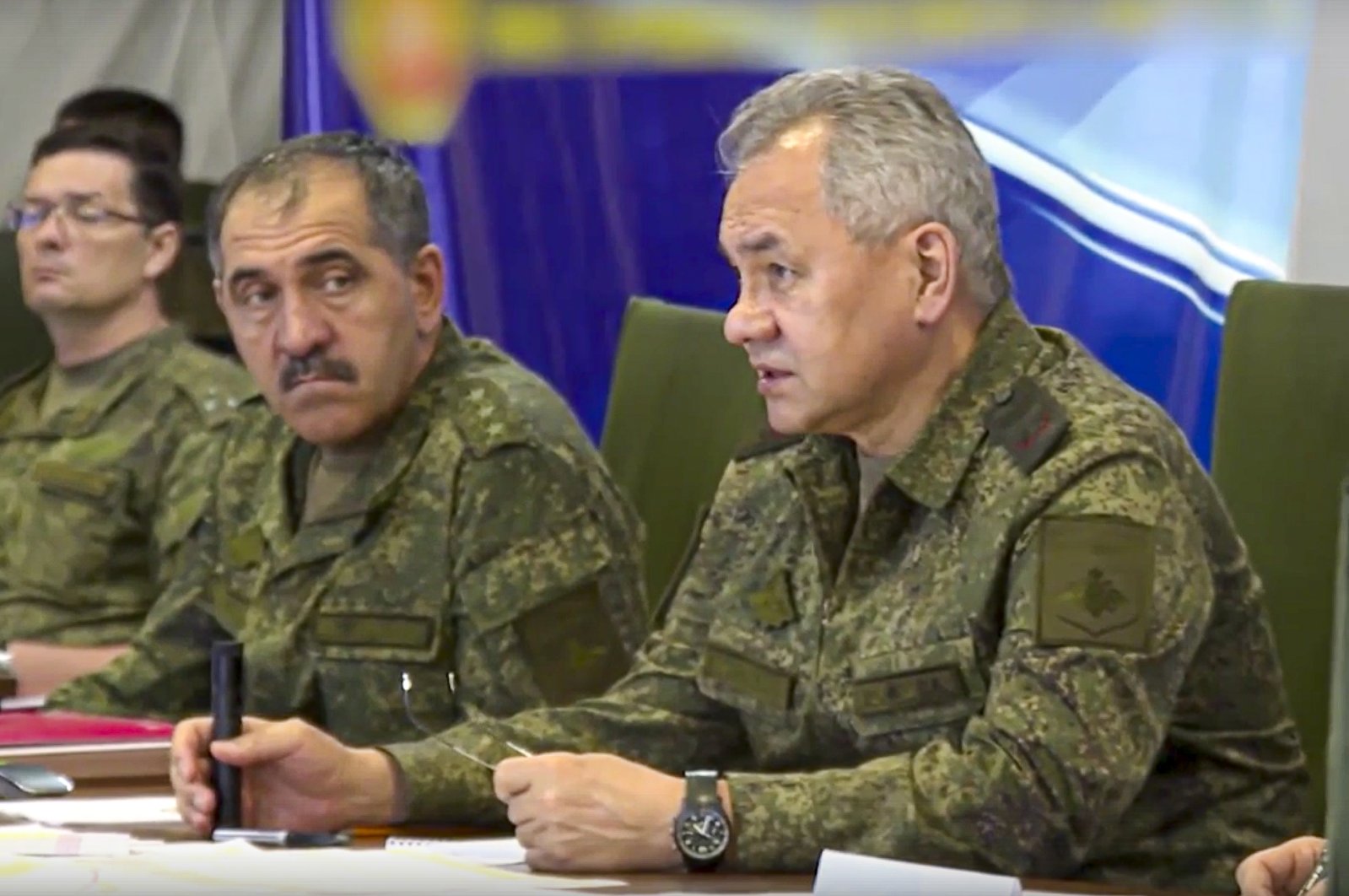 This photo taken from a video released by the Russian Defense Ministry Press Service on July 18, 2022, shows Russian Defense Minister Sergei Shoigu (R) speaking during a meeting (AP Photo)