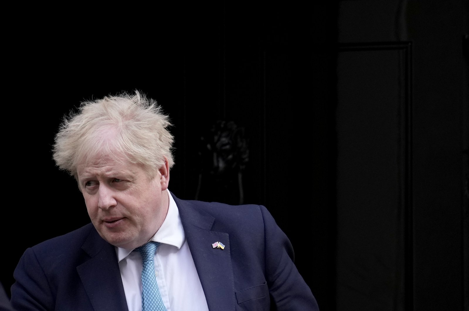 British Prime Minister Boris Johnson leaves 10 Downing Street to attend the weekly Prime Minister&#039;s Questions at the Houses of Parliament in London, March 9, 2022. (AP Photo)