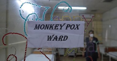 A health worker walks inside an isolation ward built as a precautionary measure for the monkeypox patients at a civil hospital in Ahmedabad, India, July 25, 2022. (AFP Photo)
