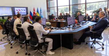 Military officers from Russia, Ukraine, Turkey and members of delegations from both countries and the U.N. attend the opening ceremony of a joint coordination center (JCC) that will oversee a U.N.-brokered deal to re-open Ukrainian grain exports in the Black Sea, in Istanbul, Turkey, July 27, 2022. (Reuters Photo)