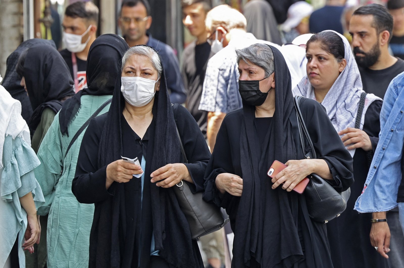 Women wearing headscarves walk in the streets of Tehran, Iran, July 12 2022.(AFP Photo)